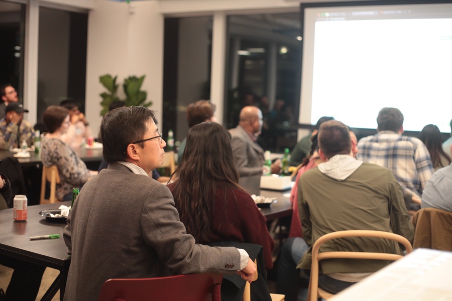 The audience watching a talk